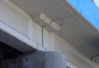 Freeway under pass face using netting to keep pigeons out