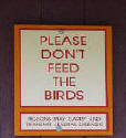 Please don't feed the birds signs don't usually work at keeping the pigeons away